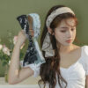 Elegant ribbon headband for women, a stylish hair accessory perfect for adding a chic touch to any outfit.