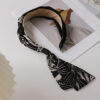 Elegant ribbon headband for women, a stylish hair accessory perfect for adding a chic touch to any outfit.