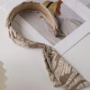 Elegant ribbon headband for women, a stylish hair accessory perfect for adding a chic touch to any outfit.